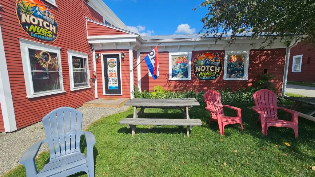 The red Notch Nugs shop on Main Street, with picnic tables and chairs out front